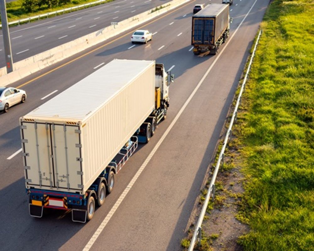 Top view of White Truck motion blur on highway road with container, transportation concept.,import,export logistic industrial Transporting Land transport on the expressway.soft focus
